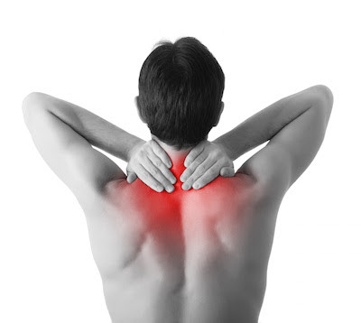 Rear view of a young man holding her neck in pain, isolated on white background, monochrome photo with red as a symbol for the hardening